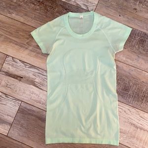 Lululemon mint green running shirt.
